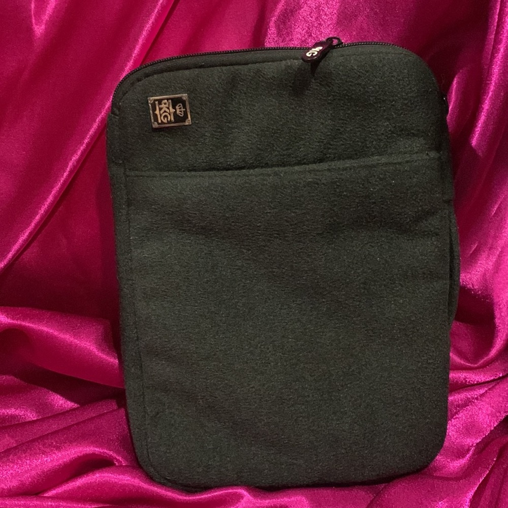 KGB iPad case. Like new. Thick material. Plaid  inside. 2 zipper compart…